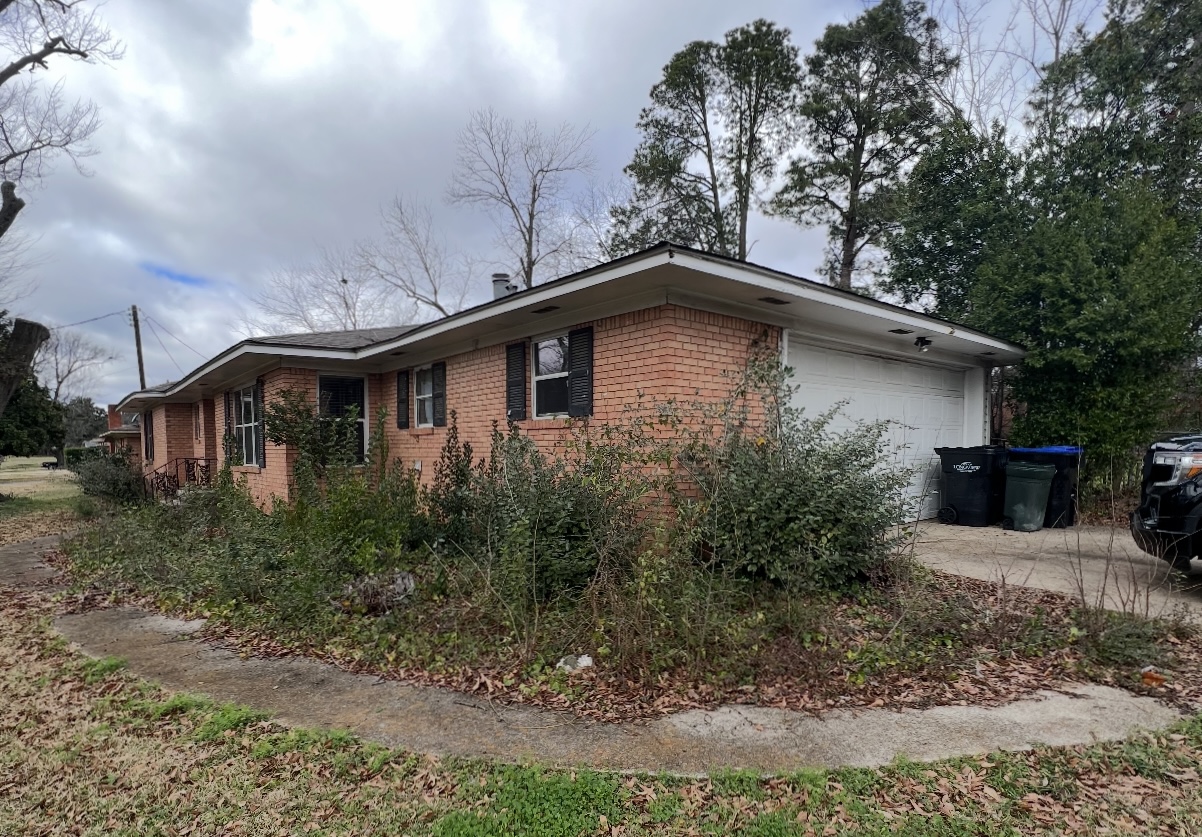 Garage exterior before renovation — angled view · Longview, Texas