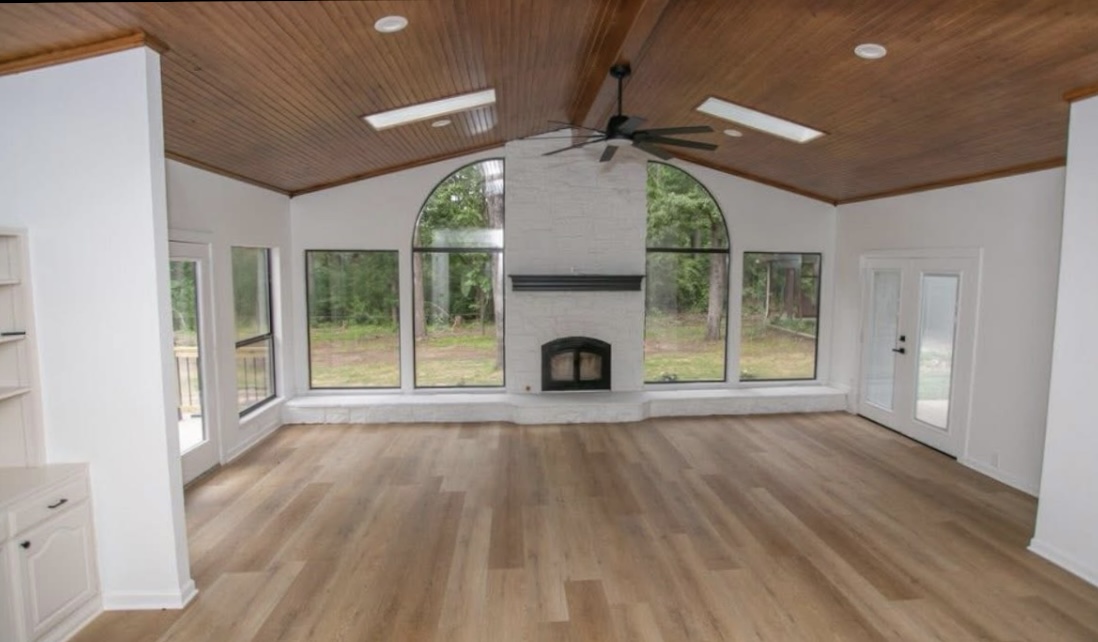 Living room — fireplace and rear windows · After renovation · Longview, Texas