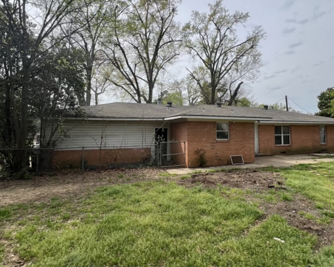 Rear exterior before renovation · Longview, Texas