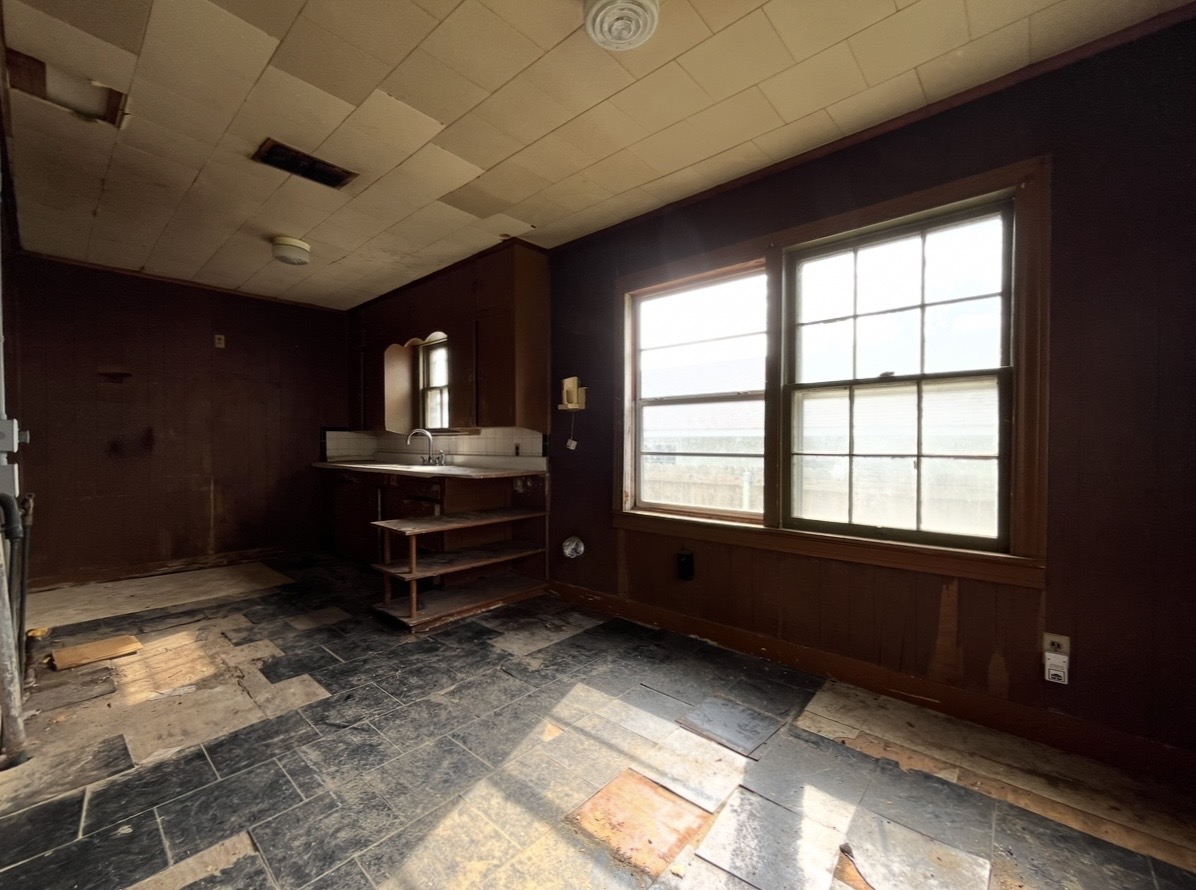 Kitchen — sink and large window · Before renovation · Tyler, Texas