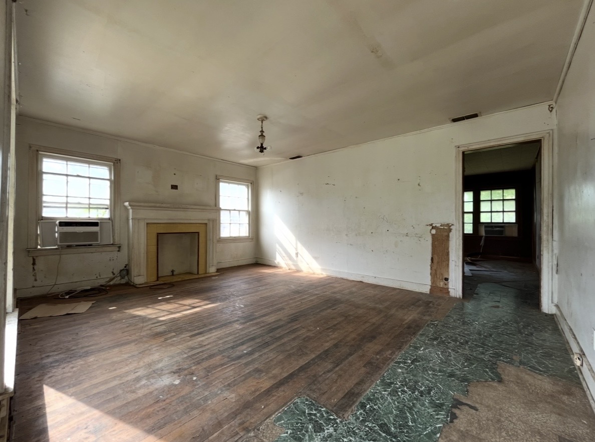 Living room with fireplace · Before renovation · Tyler, Texas
