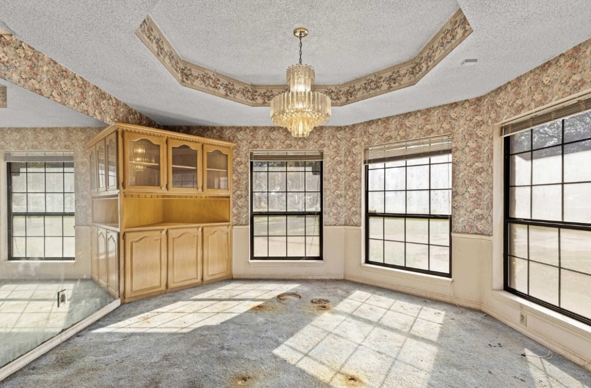 Dining area — windows and built-in cabinetry · Before renovation · Longview, Texas