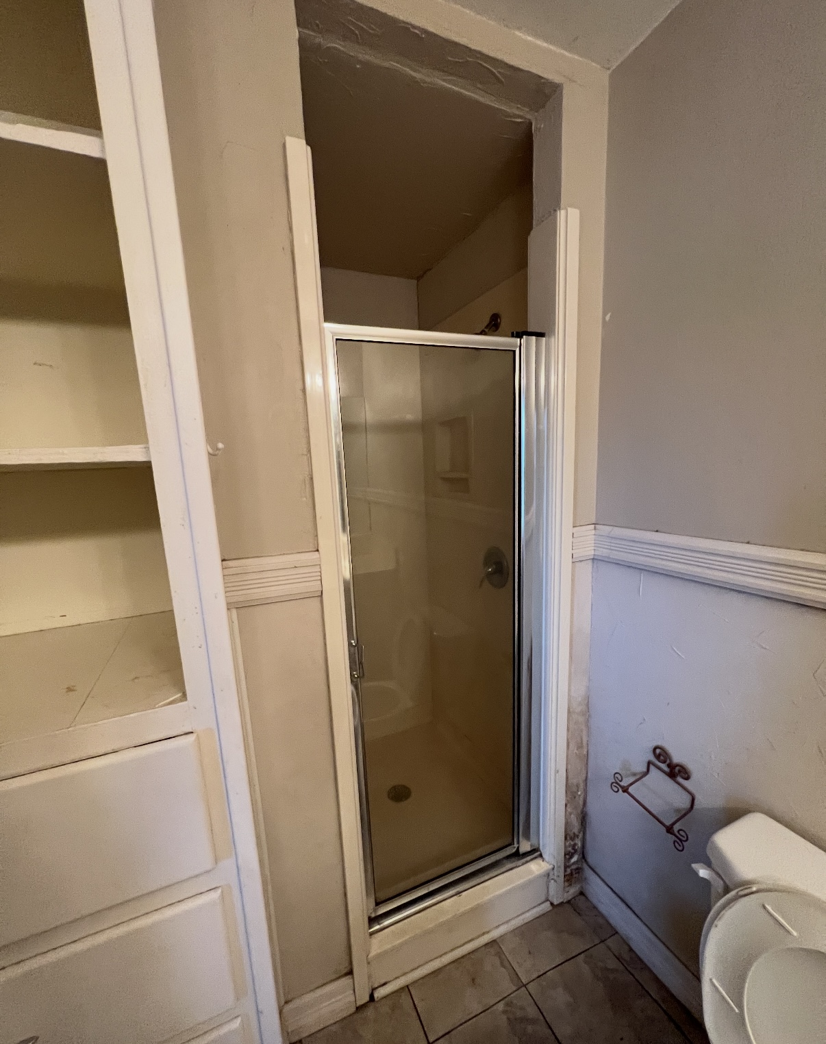 Primary bathroom shower before renovation · Longview, Texas