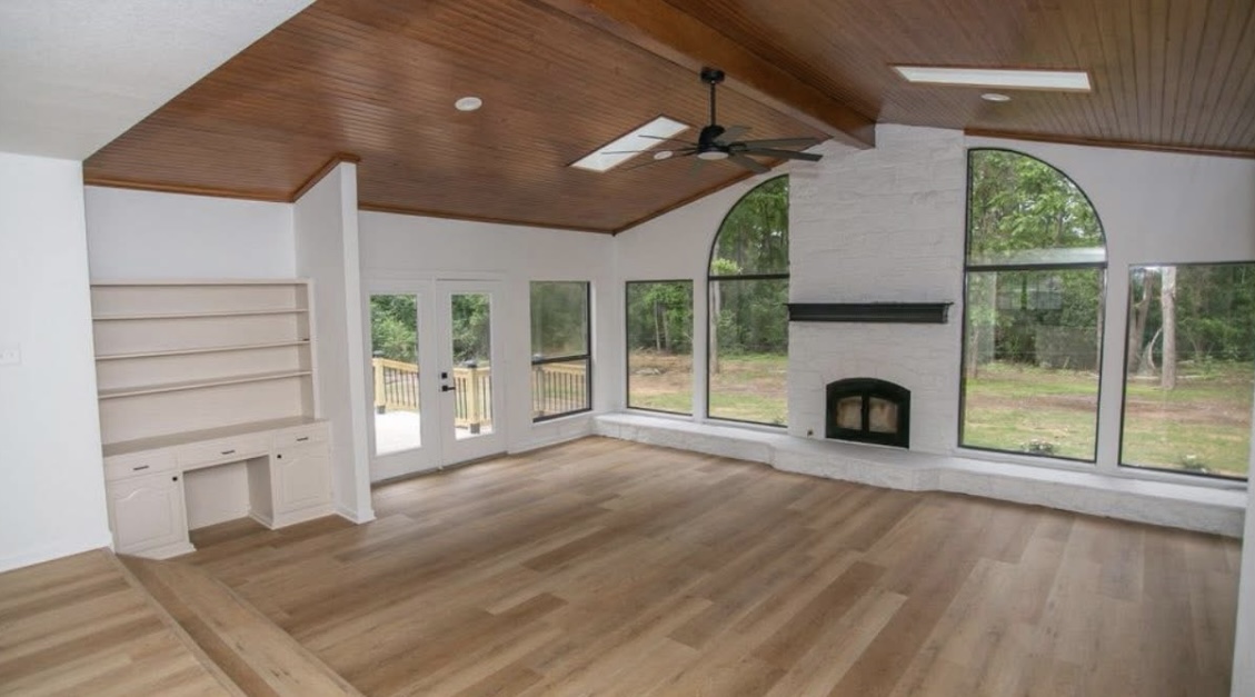 Living room — vaulted ceiling and fireplace · After renovation · Longview, Texas