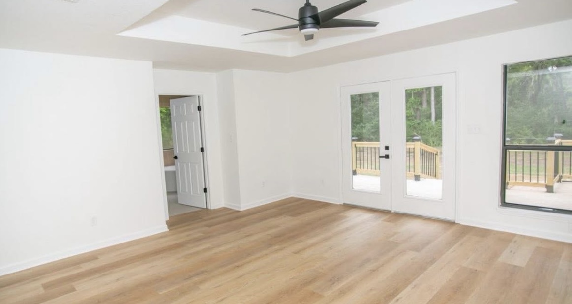 Bedroom — windows and rear door · After renovation · Longview, Texas