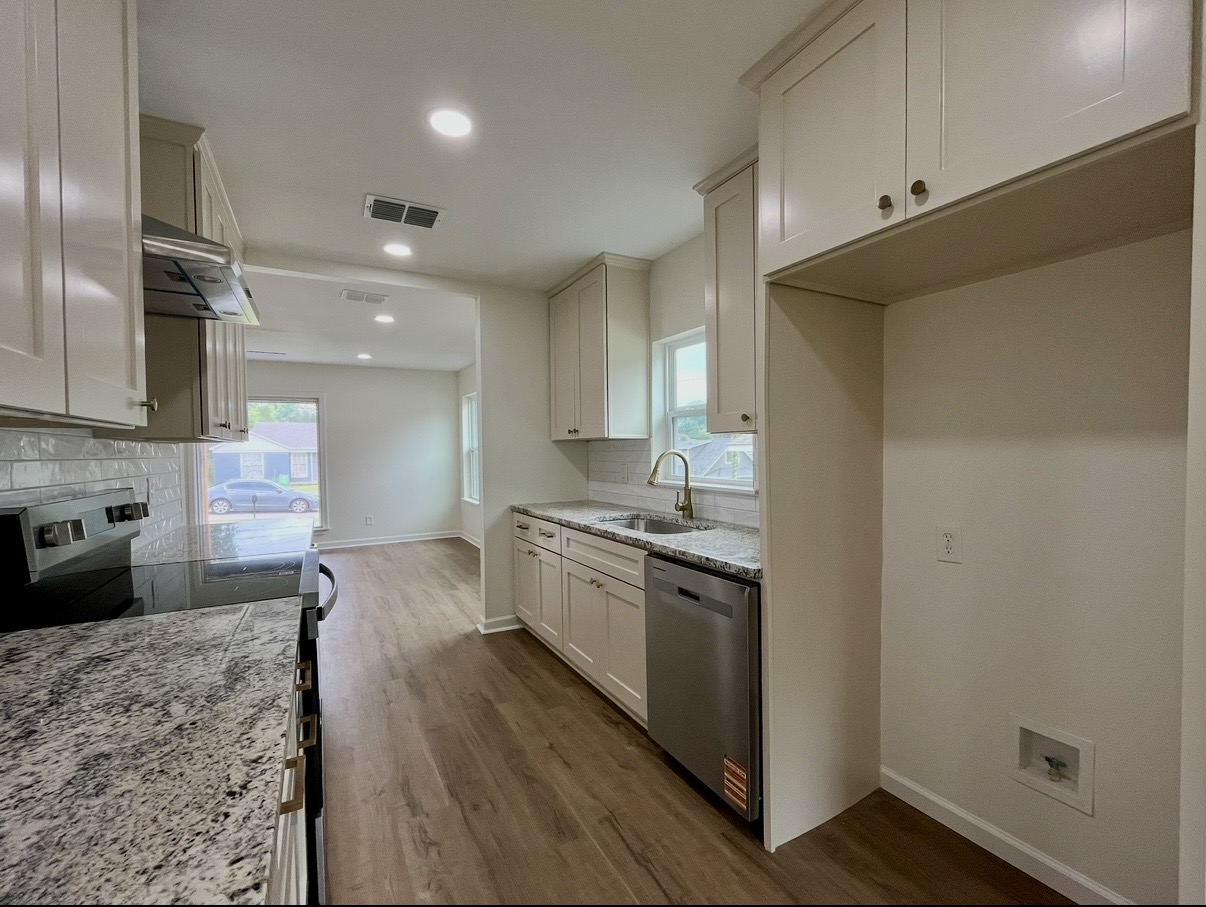Kitchen — range and tall cabinetry · After renovation · Tyler, Texas