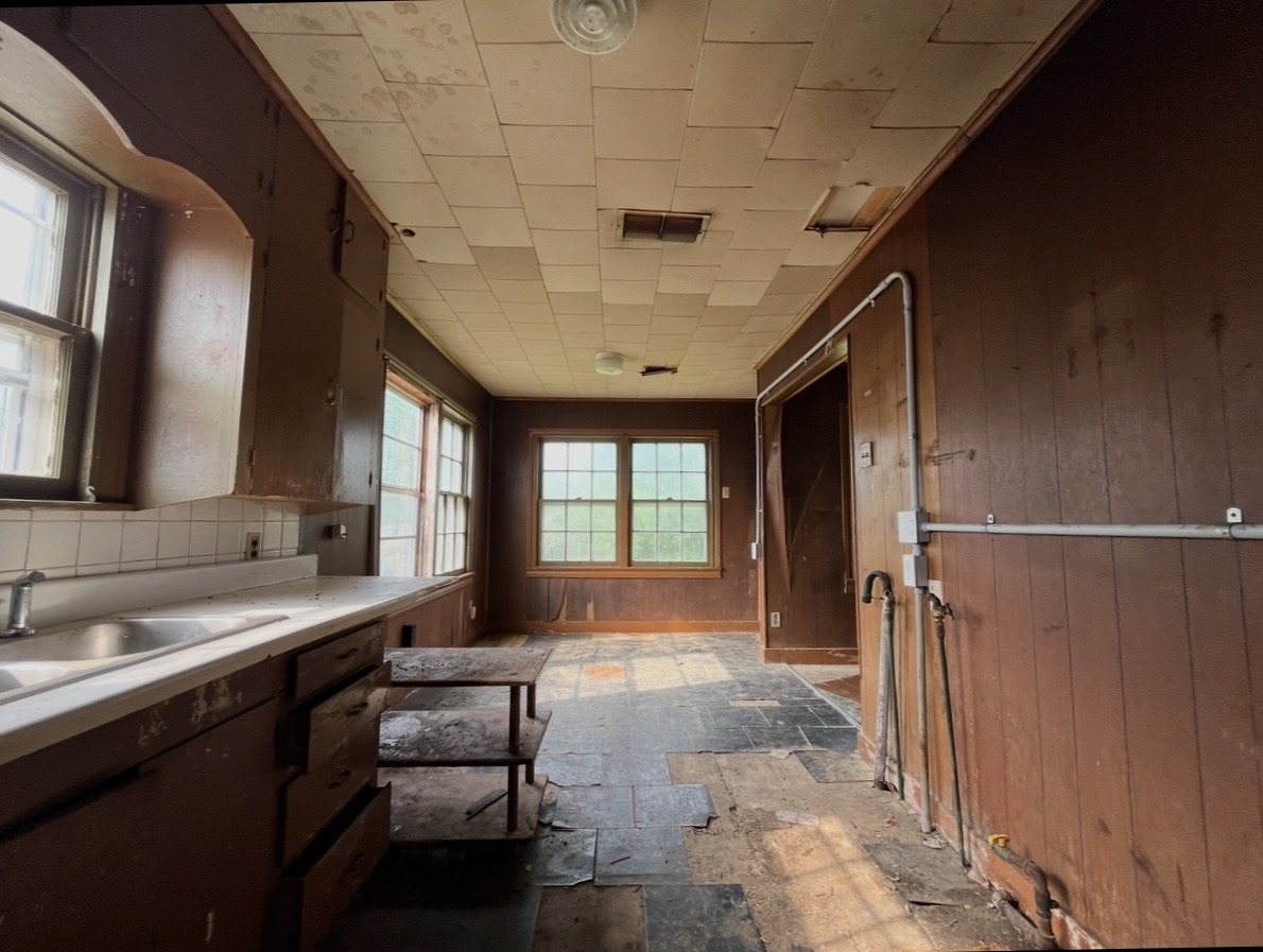 Kitchen — lengthwise view · Before renovation · Tyler, Texas