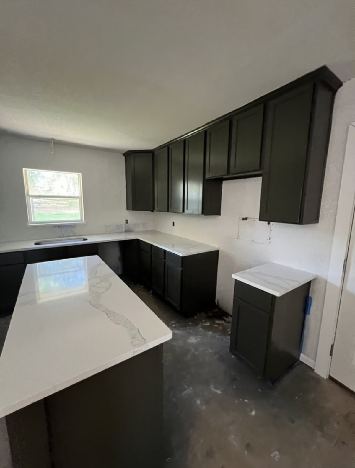 Kitchen during renovation — countertops installed · Longview, Texas
