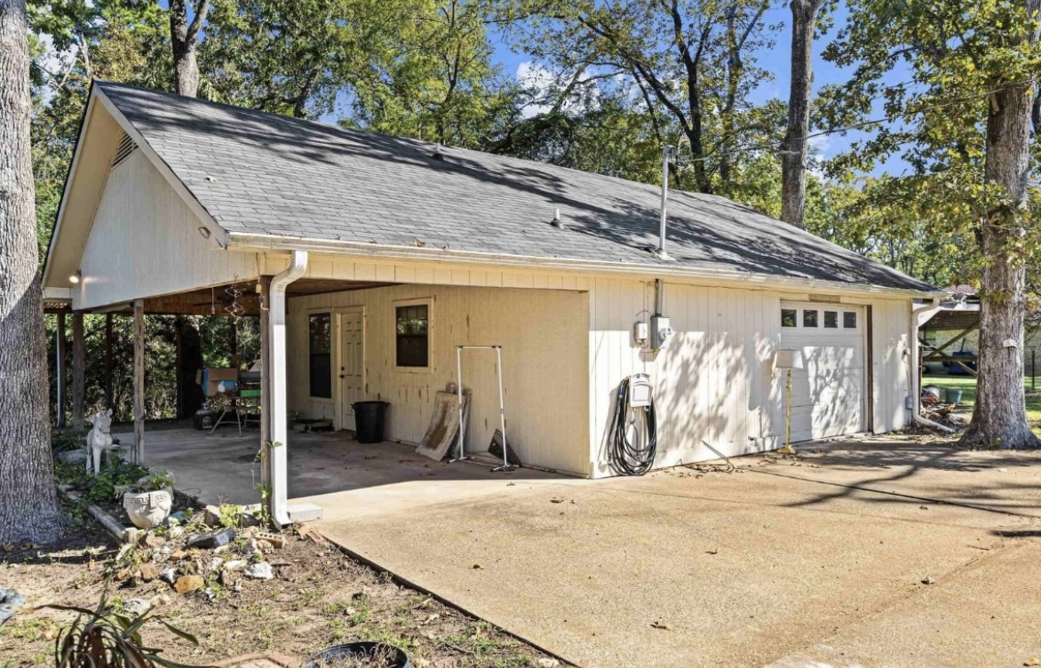 Outbuilding and covered parking · Before renovation · Longview, Texas