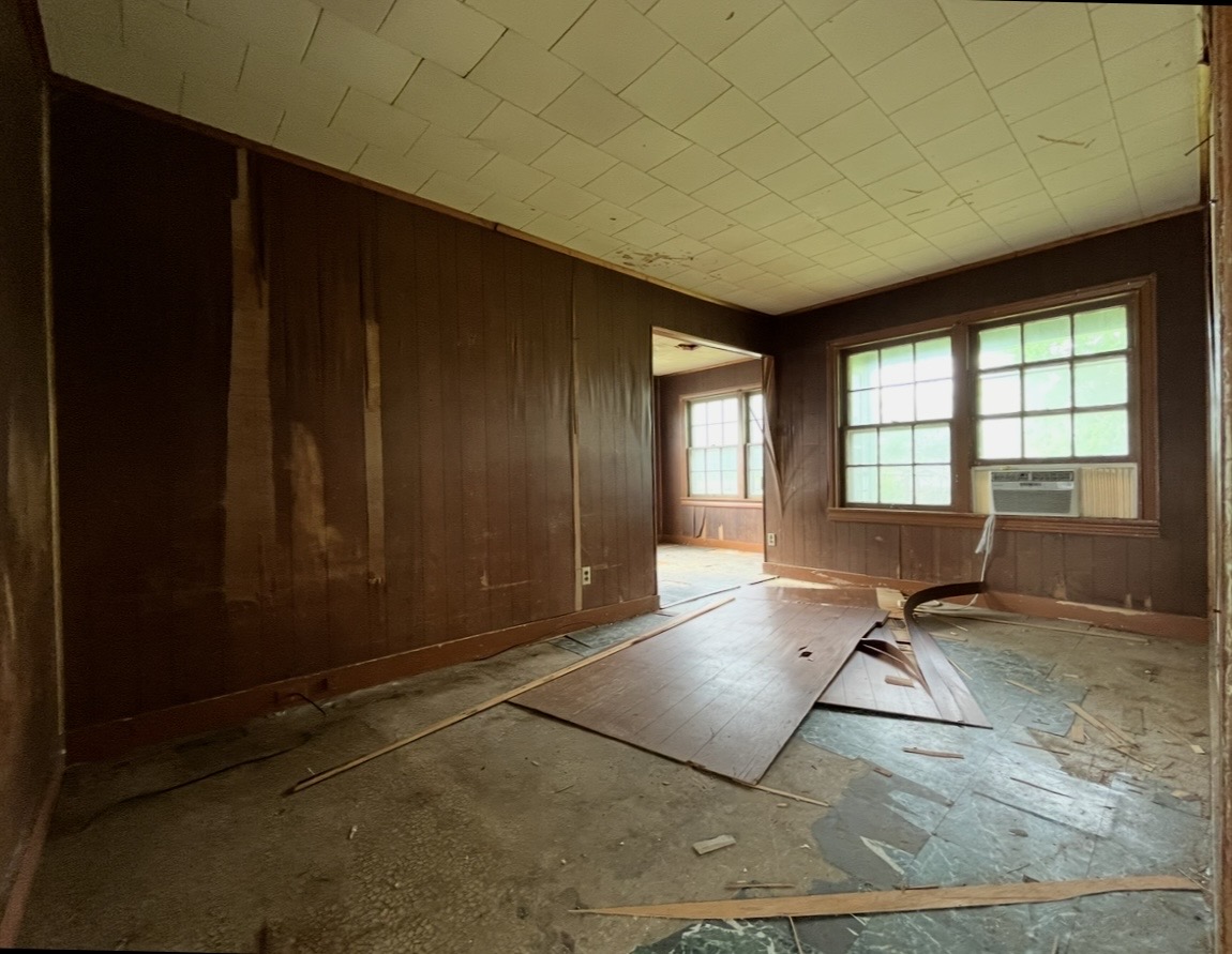 Room — paneled walls and doorway · Before renovation · Tyler, Texas
