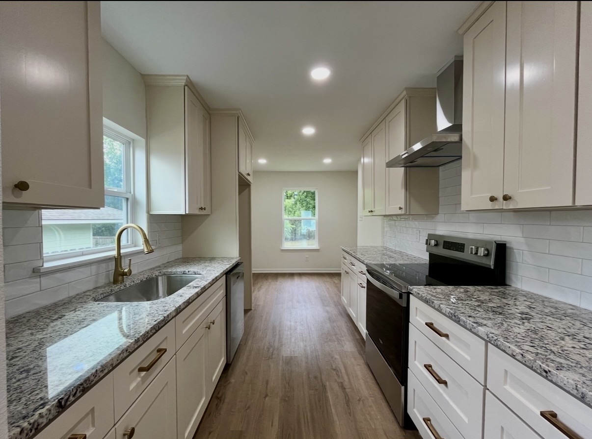 Kitchen — sink and range · After renovation · Tyler, Texas
