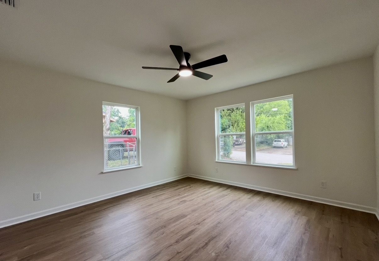 Bedroom — windows and ceiling fan · After renovation · Tyler, Texas