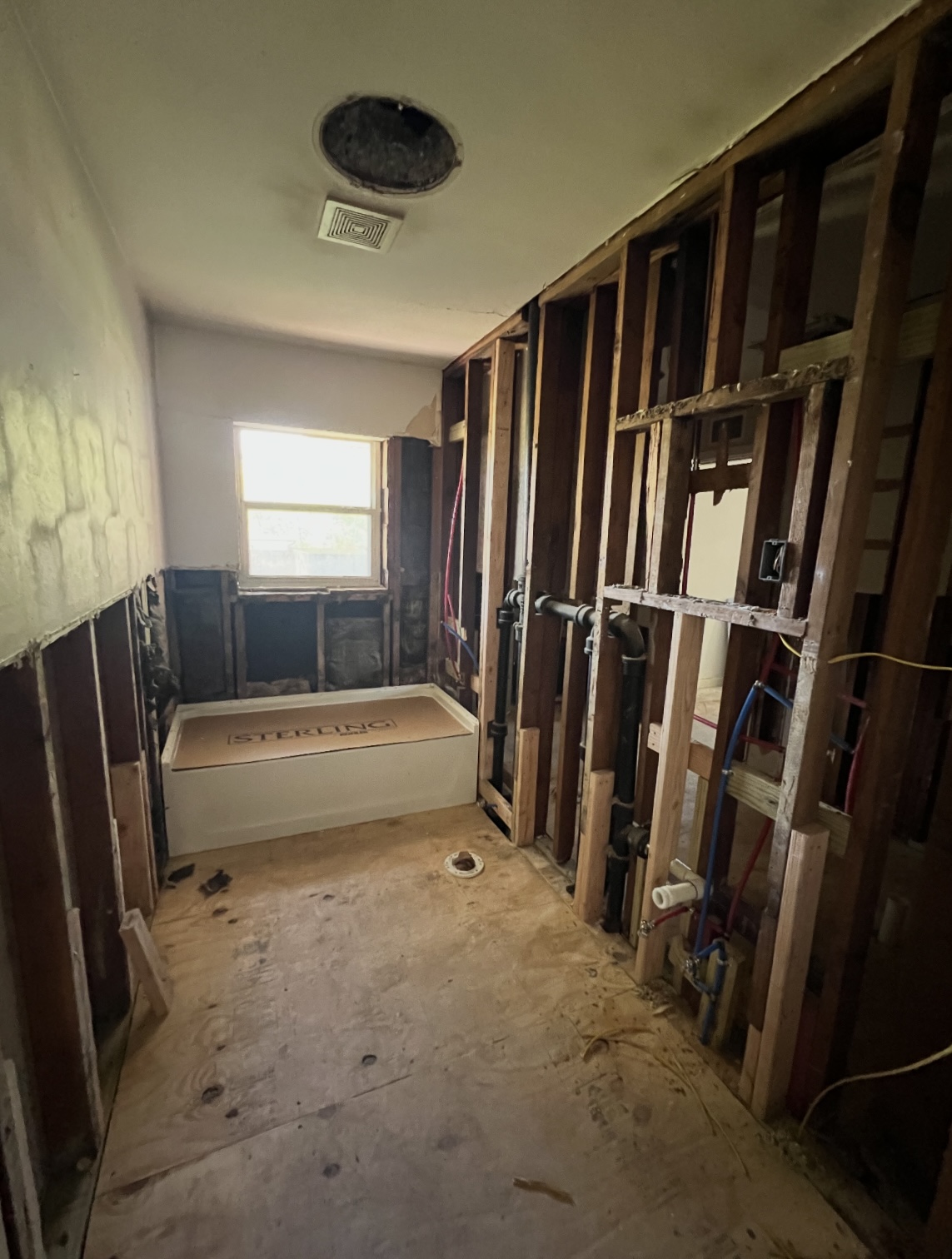 Guest bathroom during renovation — open studs · Longview, Texas