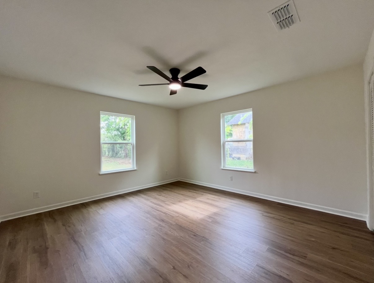Bedroom — corner windows · After renovation · Tyler, Texas