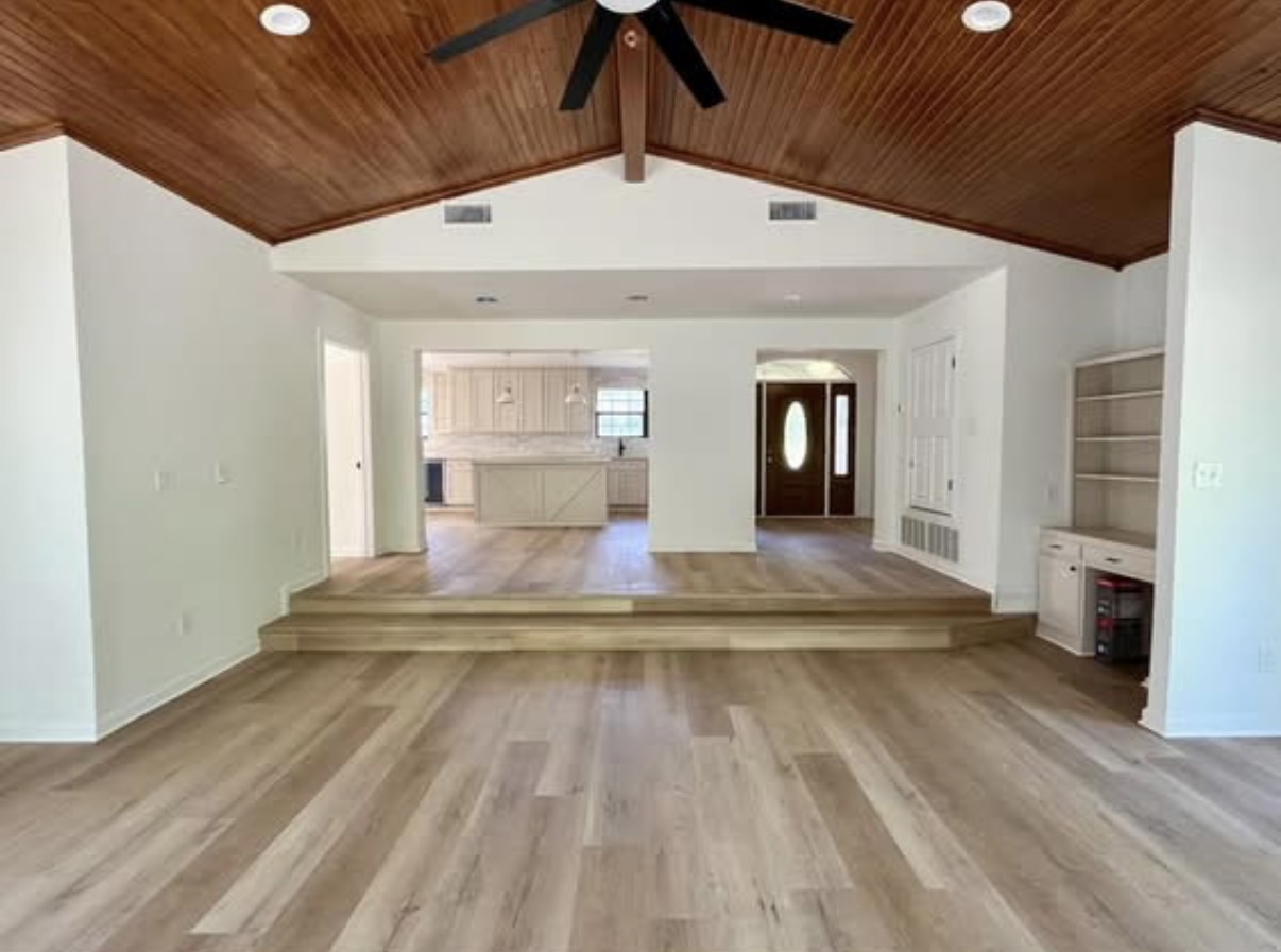 Sunken living room — steps and entrance view · After renovation · Longview, Texas