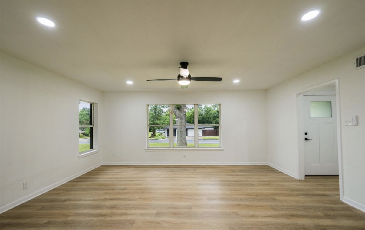 Completed living room — windows and flooring · Longview, Texas